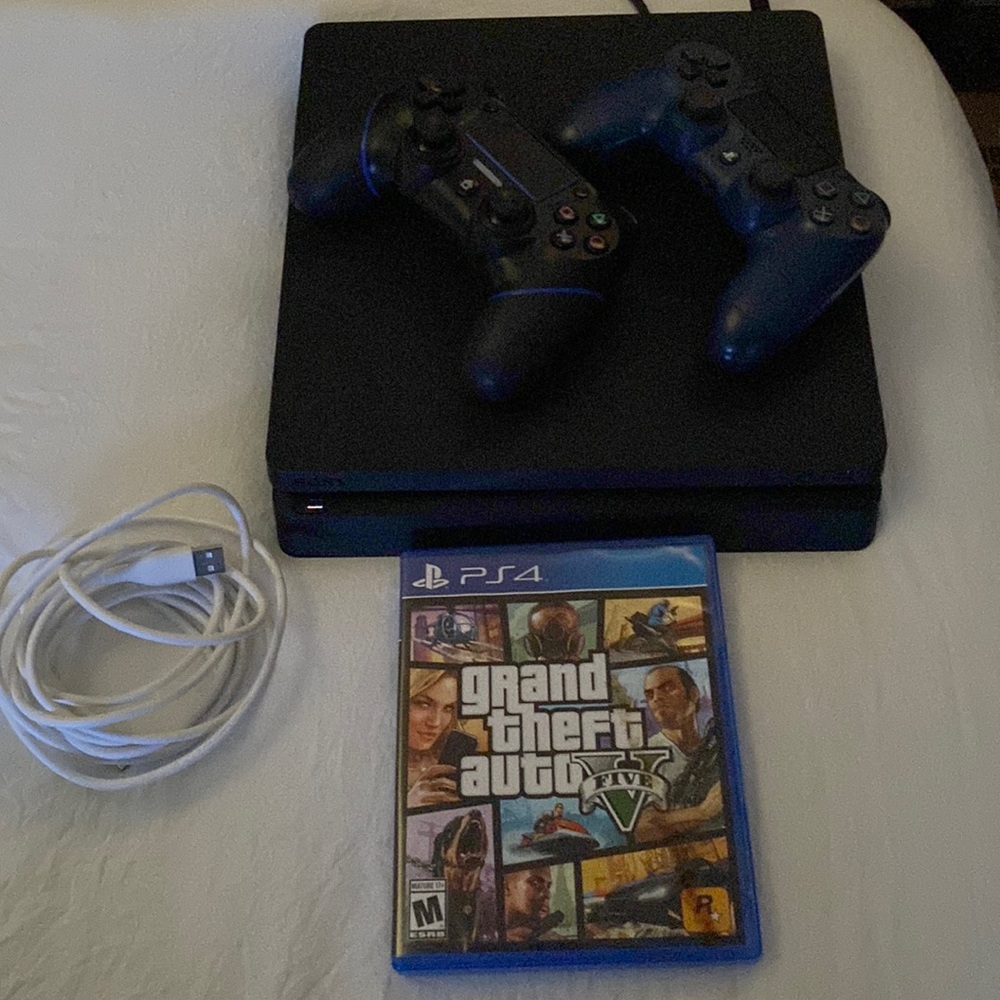 PS4 console with controllers and game